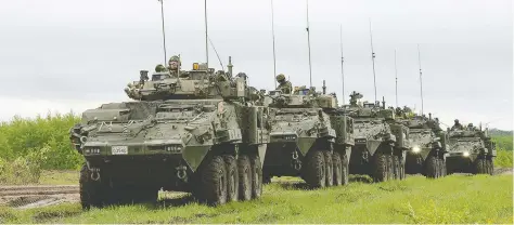  ?? SGT JEAN-FRANCOIS LAUZ / COMBAT CAMERA / GENERAL DYNAMICS ?? Canadian light armoured vehicles move in a convoy in the Wainwright Garrison training area during exercises there in 2016. The Defence Department has announced a new sole-source deal to buy 360 armoured vehicles from General Dynamics Land Systems Canada for $3 billion.