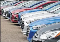  ?? AP PHOTO ?? In this Oct. 6, 2017, photo, a line of 2018 Accents, Elantras and Sonatas sits at a Hyundai dealership in the south Denver suburb of Littleton, Colo.