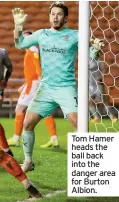  ??  ?? Tom Hamer heads the ball back into the danger area for Burton Albion.