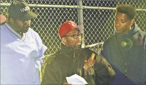  ??  ?? Earl ‘The Pearl’ Monroe (top l.) consults with Spike Lee and Denzel Washington for basketball scene in ‘He Got Game’ on Coney Island playground 20 years ago. The film outlays sleeziness in recruiting game that is still prevalent today as indicated by...