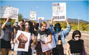  ?? ARIANA DREHSLER ?? Students march toward West Hills High School on Friday to raise awareness of racism, sexism and homophobia.