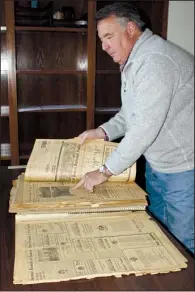  ?? Arkansas Democrat-Gazette/CYD KING ?? Lance Beaty, who bought the historic Fort Smith Masonic Temple under the name Temple Holdings LLC, found a bound book of what he believes to be every article written about the temple, which was built in 1929.