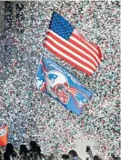  ?? Photo / AP ?? Confetti rains down on New England Patriots fans during the Super Bowl parade in Boston.