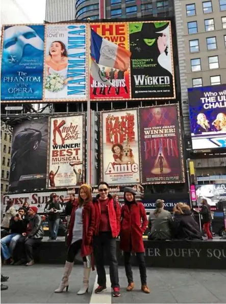  ??  ?? Surreal feeling. (From left) the writer, friend Michael Chang and twin Lin Say in the middle of Times Square, New york City.