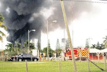  ?? FILE ?? Thick, black smoke visible from a mile away coming from the Jamalco alumina refinery at Hayes, Clarendon, during a fire at the plant in August.