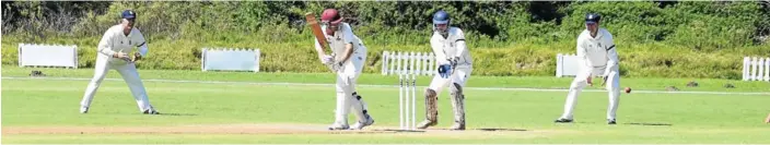  ??  ?? FINDING A GAP: A Southwell batsman hits the ball to leg as Salem fielders and wicket-keeper look on in the final match of the Pineapple Cricket Tournament at the Country Club on Saturday