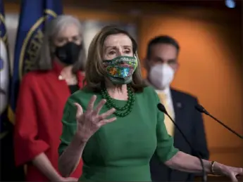  ?? J. Scott Applewhite/Associated Press ?? House Speaker Nancy Pelosi, D-Calif., speaks to reporters before a late-night House vote, which was expected to move forward the $1.9 trillion pandemic relief package along a party-line vote. Republican­s complained that the bill was unfocused, while Democrats argued that the American people don’t want partisan bickering to delay the stimulus.