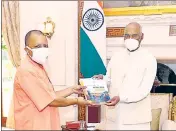  ??  ?? Chief minister Yogi Adityanath with President Ram Nath Kovind and (right) BJP national president JP Nadda during separate meetings, in New Delhi, on Friday.