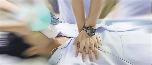  ?? DEPOSIT PHOTOS ?? Medical personnel perform CPR on a patient in this stock photo. The Canadian Red Cross says it’s best to play it safe when dealing with victims who may have taken opiods, such as fentanyl and carfentali­l.