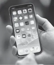  ?? AFP-Yonhap ?? The new iPhone X, displayed during the Apple event, is seen as a milestone for the tech giant a decade after the first iPhone release.