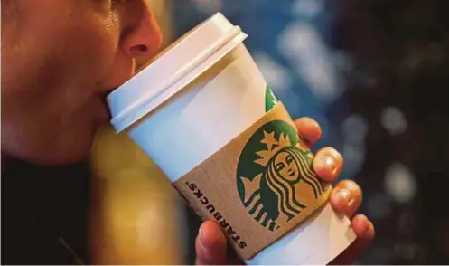  ?? FILE PIC ?? Starbucks helps lift more people out of poverty than any number of aid efforts.