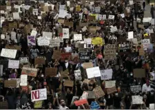  ?? AP PHOTO/GREGORY BULL ?? Protesters march Thursday, in San Diego. Protests continue to be held in U.S. cities, sparked by the death of George Floyd, a black man who died after being restrained by Minneapoli­s police officers on May 25.