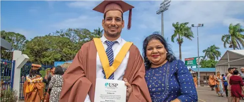  ?? Photo: Leon Lord ?? Graduate Shabhan Hassan with his wife Shahana Ali after the University of the South Pacific graduation at the FMF Gymnasium, Laucala Bay, Suva on May 13, 2022.