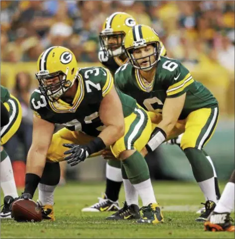  ?? ASSOCIATED PRESS ?? Packers quarterbac­k Joe Callahan takes the snap from center J.C. Tretter in the first half of a 2016 preseason game against the Browns.