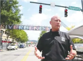  ?? STAFF PHOTO BY ERIN O. SMITH ?? Chattanoog­a police Lt. Austin Garrett talks about security measures being taken this year for the Riverbend Festival during a news conference at the entrance to the Riverbend Festival on Chestnut Street at Aquarium Way on Thursday. Garrett has worked...