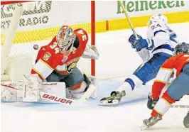  ?? CHARLES TRAINOR JR./TNS ?? Florida Panthers goalie James Reimer watches as the Tampa Bay Lighting’s Ryan Callahan (24) scores in the second period of Sunday’s game.