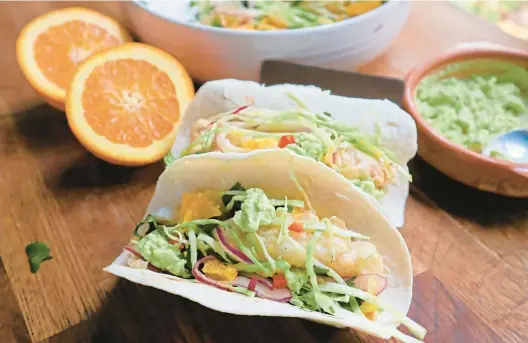  ?? GRETCHEN MCKAY/PITTSBURGH POST-GAZETTE ?? Beer-battered fish for tacos is cooked in an air fryer instead of an oven in the latest edition of the “Betty Crocker Cookbook.”