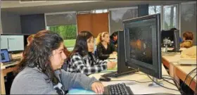  ?? SUBMITTED PHOTO ?? PWHS senior Shreya Bhutani, foreground, and other students prepare for the TSA national competitio­n last summer.