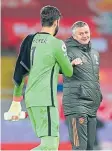  ??  ?? Alisson Becker with United boss Ole Gunnar Solskjaer at full-time.