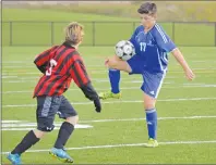  ?? T.J. COLELLO/CAPE BRETON POST ?? Justin Ferguson of the Sydney Academy Wildcats, right, corrals the ball while being pressured by Connor MacIntyre of the Glace Bay Panthers during Highland Region Division 1 boys soccer playoff action Tuesday at Open Hearth Park in Sydney. Sydney...