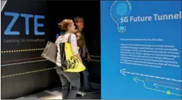  ?? JUDY ZHU / CHINA DAILY ?? CES 2018 attendees step into ZTE’s 5G Future Tunnel to find out what fifth-generation mobile technology is all about on Wednesday in Las Vegas.