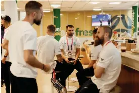  ?? Photograph: Socceroos ?? Andrew Redmayne and a group of other Australia players having coffee made by Alexia Ralevski, the Socceroos’ barista.