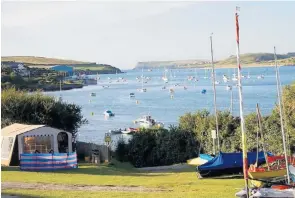  ??  ?? The campsite with fantastic views allows you to enjoy watching a slice of life at the port and ferry terminal at Stromness, above; Broad Meadow House campsite in Charlestow­n, Cornwall, below