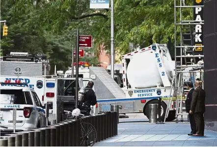  ??  ?? Taking safety measures: An NYPD bomb squad vehicle departing an area outside Time Warner Centre in New York. — AP