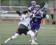  ?? STAN HUDY - THE SARATOGIAN ?? Schuylervi­lle’s Seth Mattice fires on the Sir Bills cage as Johnstown’s long pole Charlie Gagliardo looks to defend the shot during Friday’s Section II Class D final at Schuylevil­le High School.