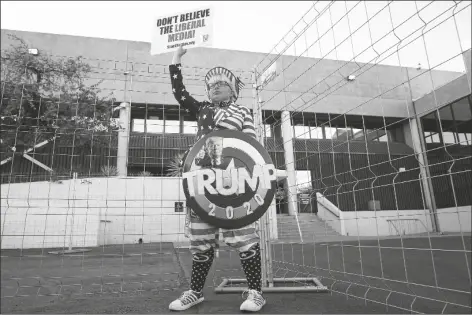  ?? ASSOCIATED PRESS ?? SUPPORTER OF PRESIDENT DONALD TRUMP, TARA IMMEN, of Happy Valley, protests in front of the Maricopa County Elections Department as the agency conducts a post-election logic and accuracy test for the general election Wednesday in Phoenix.