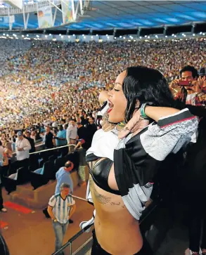  ?? Picture: AKM-GSI ?? RIHANNA DE JANEIRO: Rihanna flashes her bra to celebrate Germany’s goal against Argentina during the World Cup final in Brazil