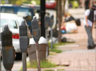  ?? JOHN BERRY — THE TRENTONIAN ?? Parking meters along South Broad Street in Trenton are in various states of disrepair.