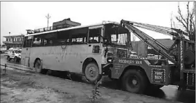  ??  ?? A damaged bus is towed away following the attack. (Photo: CNN)