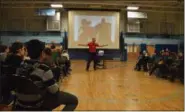  ?? PHOTO PROVIDED ?? Former profession­al mixed martial arts fighter Tom Murphy speaks to students during an assembly at Goff Middle School.