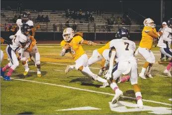  ?? Photo courtesy of Meghan Lessard Photograph­y ?? Quarterbac­k Nick Afato (5) and Yuba City football look to close out the regular season with a win over Woodcreek at home Friday night. Kickoff is set for 7:15 p.m.