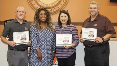  ?? ?? Certificat­es for Outstandin­g Educationa­l Performanc­e:
Pictured left to right are MHS Assistant Principal, Manuel Bulhoes; MSD Assistant Superinten­dent, Lillian Harper; MHS Principal, Jennifer Shnaekel; and MMS Principal, Ben Dial. The principals accepted Certificat­es of Outstandin­g Educationa­l Performanc­e, which Harper bestowed to them for marked improvemen­t seen on their respective campuses in the Math and ELA course programs, as reported by the Arkansas Dept. of Education.