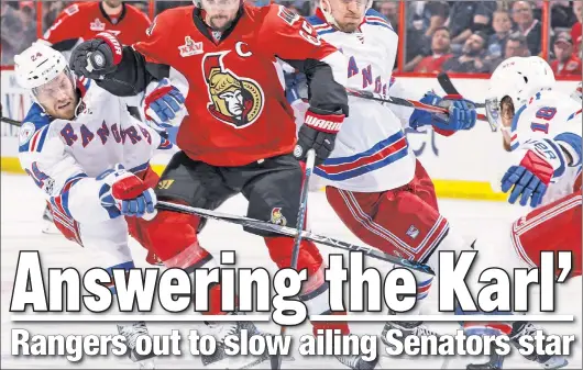  ??  ?? GET HIM! Even while playing with two hairline fractures in his left heel, Senators captain Erik Karlsson is “the elite of the elite,” according to Alain Vigneault. But, the coach said the Rangers have to find a way to “slow him down, impede his way a...