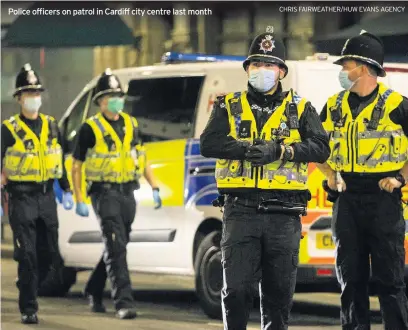  ?? CHRIS FAIRWEATHE­R/HUW EVANS AGENCY ?? Police officers on patrol in Cardiff city centre last month