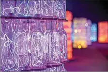  ?? PHOTO BY CHRIS HARDY ?? A closeup of the wine bottles used in Light Towers of the newly renamed Bruce Munro: Light at Sensorio, which reopens to the public on April 15 in Paso Robles.