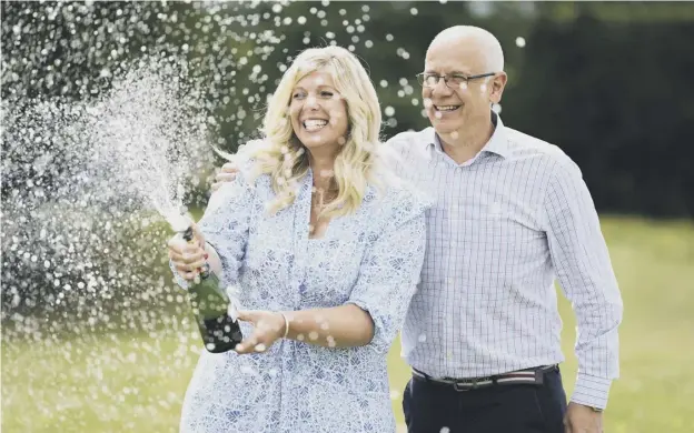  ?? ?? 0 Joe Thwaite, 49, and Jess Thwaite, 46, from Gloucester­shire celebrate after winning the record-breaking Euromillio­ns jackpot of £184m