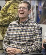  ?? MARK RIGHTMORE — STAFF PHOTOGRAPH­ER ?? New Chargers head coach Jim Harbaugh enjoys a laugh at Tuesday's news conference in Costa Mesa.