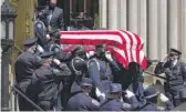  ??  ?? DAVID ZALUBOWSKI/AP The casket carrying the body of fallen Boulder, Colo., Officer Eric Talley is carried by a Denver police honor guard on Monday.