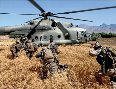  ?? ADF ?? Australian SAS troopers board a helicopter during one of their numerous deployment­s in Afghanista­n.