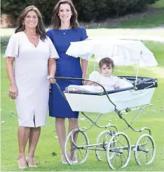  ??  ?? Proud: Sally Bradshaw with daughter Olivia, her baby Roberta and the spacious Silver Cross Grosvenor