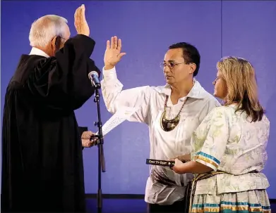  ?? Photo submitted ?? Cherokee Nation Principal Chief Chuck Hoskin Jr. takes his oath of office alongside First Lady January Hoskin. Supreme Court Justice John Garrett officiated the oath.