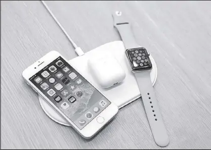  ?? REUTERS ?? An AirPower wireless charger is displayed along with other products during an Apple launch event in Cupertino, California.