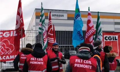  ?? Photograph: Marco Bertorello/AFP/Getty Images ?? Amazon employees demonstrat­e in front of the company’s premises in Brandizzo, near Turin.