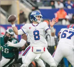  ?? RICH HUNDLEY III — 21ST-CENTURY MEDIA PHOTO ?? Giants quarterbac­k Daniel Jones (8) passes the ball against the Eagles during a game at MetLife Stadium in East Rutherford. Jones won’t play on Sunday against the Dolphins due to a neck injury.