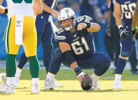  ?? SEAN M. HAFFEY GETTY IMAGES ?? Scott Quessenber­ry. a La Costa Canyon High alumnus, has been the Chargers’ No. 1 center the second half of the season. “It’s been a good season for learning purposes,” he says.