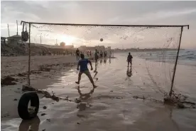  ?? ?? People playing football on Yoff beach in Dakar.